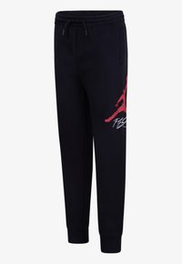 Černé jogger kalhoty s elastickým pasem a stahovací šňůrkou, s velkým červeným siluetovým motivem na stehně a bočními kapsami.