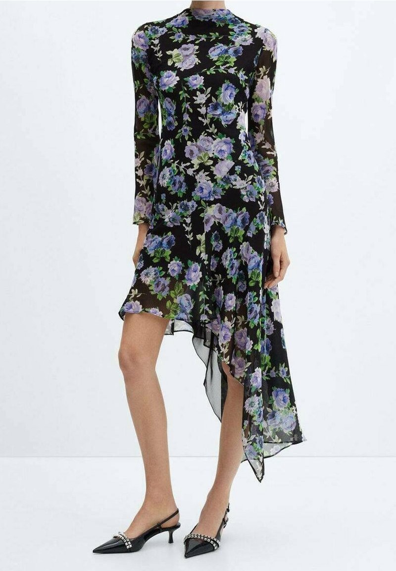 Sheer black dress with long sleeves, features a floral pattern in purple and green. Asymmetrical hem creates a flowing silhouette.