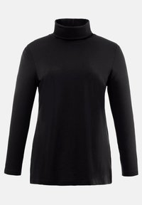 Maglione a collo alto nero a maniche lunghe. Tessuto morbido, design aderente, colletto alto, spalle senza cuciture e orlo dritto in vita.