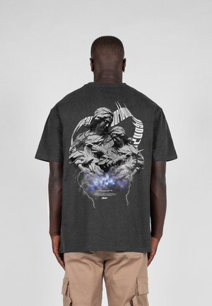 Dark gray cotton t-shirt featuring a graphic print of two figures with intricate details and swirling text, accented by blue and gray effects.