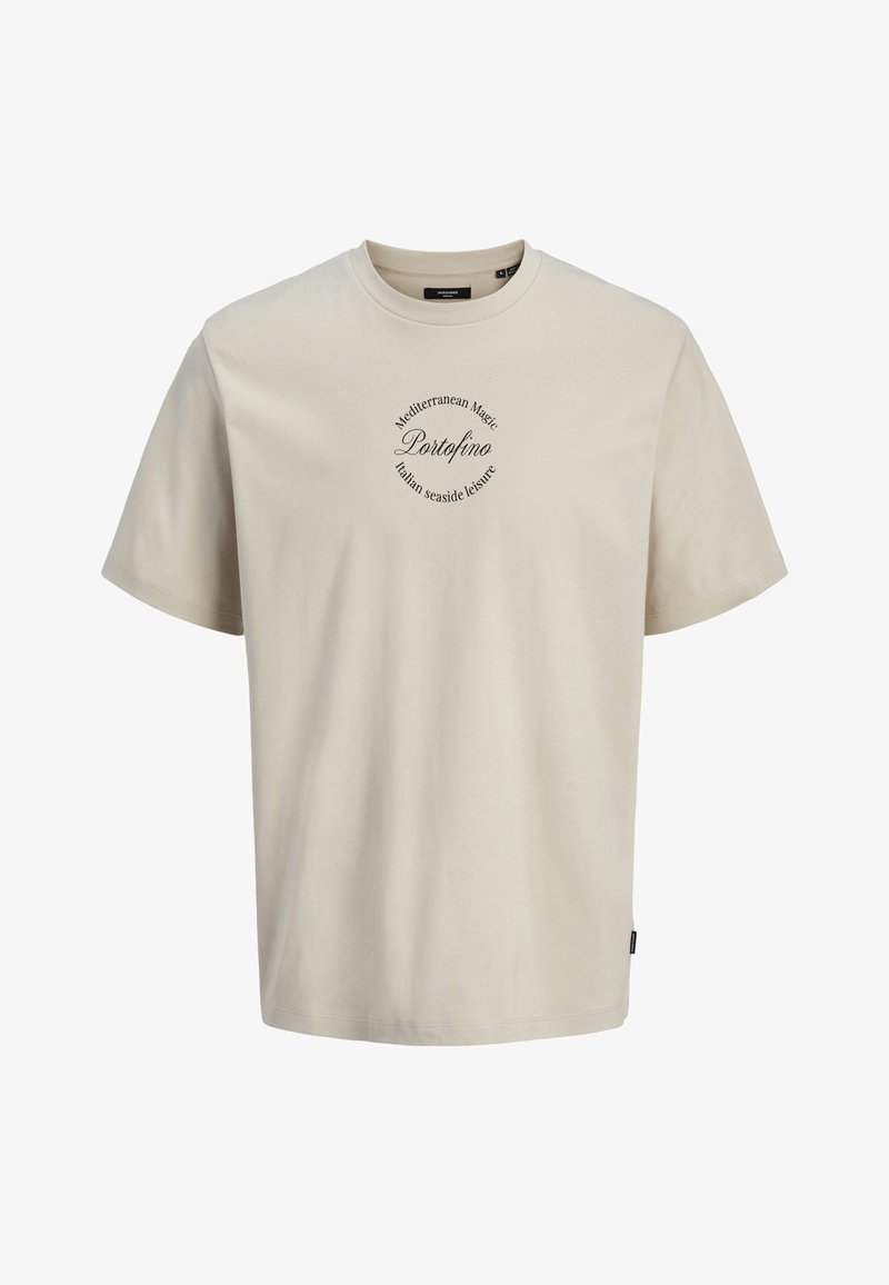 Helles beige T-Shirt mit kurzen Ärmeln aus weicher Baumwolle. Es hat einen runden Halsauschnitt und ein zentrales grafisches Textdesign mit geschwungener Schrift.