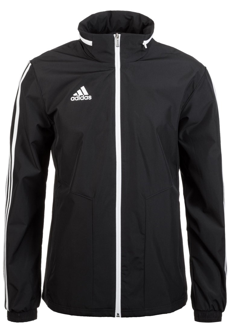 Chaqueta Adidas negra con cremallera blanca en el frente, dos bolsillos delanteros y acentos de tres rayas blancas en las mangas. Material de poliéster.