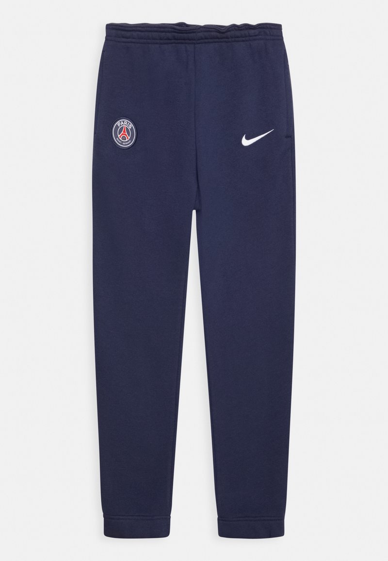 Tmavě modré tepláky vyrobené z měkké látky, na jedné noze s logem Paris Saint-Germain a na opačné straně s bílým logem Nike.
