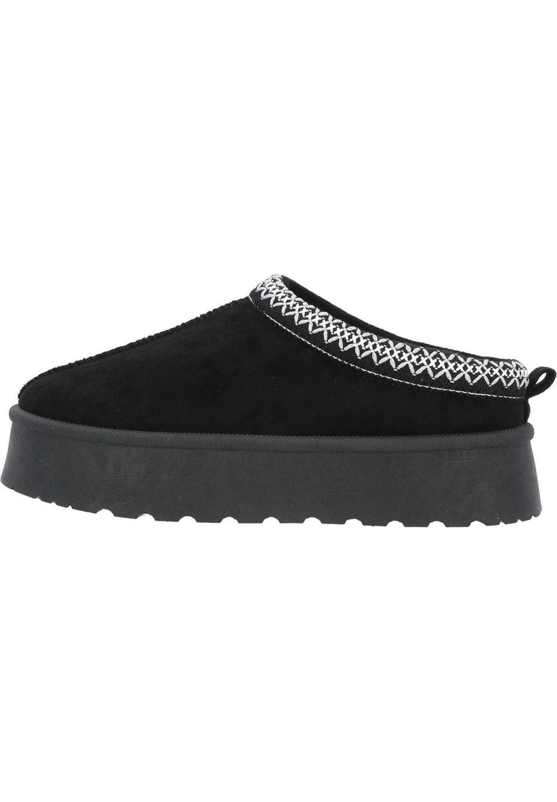Svart mocka slip-on sko med en tjock gummisula, med vit dekorativ söm runt kragen och en dragflik bak.