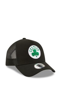 Black mesh cap with a curved brim, featuring a circular white patch with green "Celtics" text and a clover design. New Era logo on visor.
