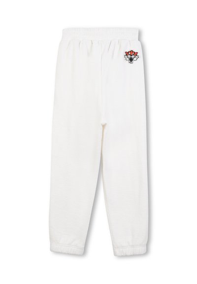 Pantalons de survêtement blancs avec une taille élastique, présentant un motif brodé coloré sur la hanche gauche. Style doux et décontracté pour un maximum de confort.