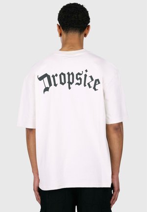 White cotton t-shirt featuring a large, dark graphic text "Dropsize" on the back. Short sleeves and a relaxed fit with a straight hem.