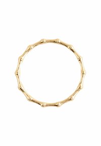 Bracelet jonc en métal doré présentant un design inspiré du bambou avec des sections alternées texturées et lisses, créant un motif naturaliste.