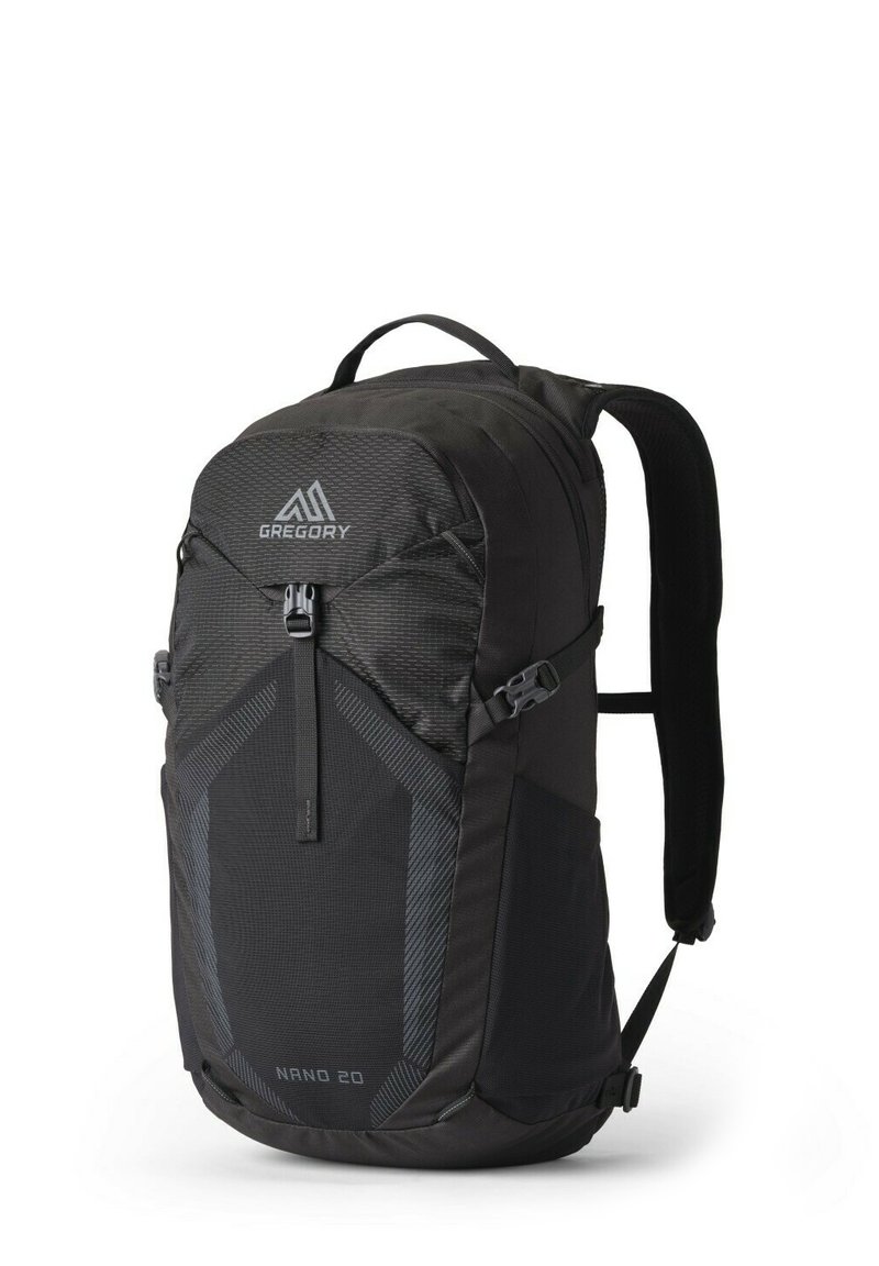 Black backpack with a streamlined design, featuring textured fabric, a front zip pocket, logo, and padded shoulder straps. Model: Nano 20.