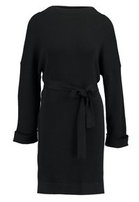 Svart ribbad stickad klänning med långa ärmar och knytdetalj i midjan. Har en rund halsringning och uppvikta manschetter för extra textur.