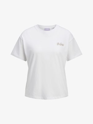 T-shirt blanc à manches courtes et col rond avec le texte "La Siesta" en beige clair sur la poitrine gauche.