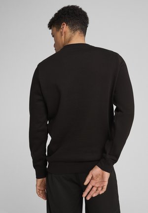 Sort sweatshirt lavet af blødt materiale, med rund hals, lange ærmer og et tætsiddende taljebånd, vist fra ryggen.