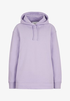 Jasnofioletowa bluza z kapturem i pasujące dresy wykonane z miękkiego materiału. Luźny krój z regulowanym kapturem i ściąganymi spodniami, w zestawie z białymi trampkami.
