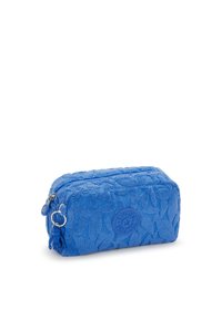 Portafashion in spugna blu, di forma rettangolare con chiusura a zip, dotato di un motivo floreale e di un logo circolare sul lato.