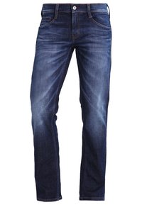 Tmavě modré džíny z denimu s úzkým střihem, jemným opotřebením, standardním designem s pěti kapsami a zapínáním na knoflík a zip.