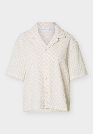 Kortermet beige og hvit rutete skjorte med knapper, spiss krage og teksturert stoff.