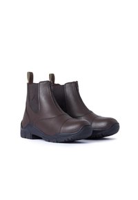 Botas de tobillo de cuero marrón con cremalleras, suelas de goma y forro textil. Cuenta con paneles laterales elásticos y lengüetas para facilitar su colocación.