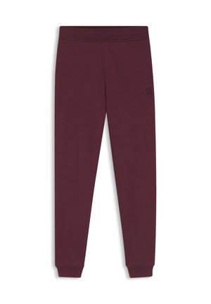 Pantaloni della tuta color bordeaux con design aderente, realizzati in tessuto morbido. Presentano un piccolo logo in rilievo vicino alla vita e caviglie con risvolto.