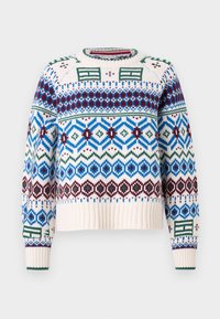 Maglione lavorato a maglia con una base color crema e motivi geometrici multicolori in blu, verde, borgogna e nero. Polsini e orlo a coste.