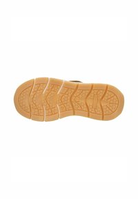 Rubber sneaker sole with a light tan color, featuring a textured grip pattern and multiple flex grooves for enhanced flexibility.