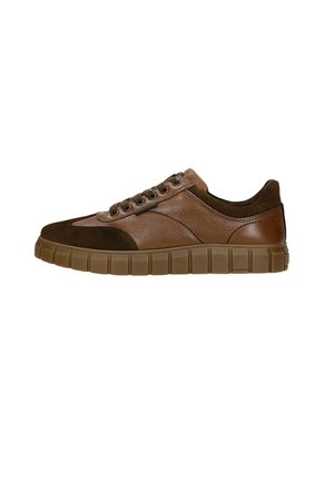 Brown leather and suede sneaker with a textured upper, round toe, and flexible rubber sole featuring a segmented design.