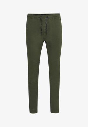 Olive green tapered jogger pants made of soft fabric, featuring an elastic waistband with drawstring, side seams, and ribbed cuffs.