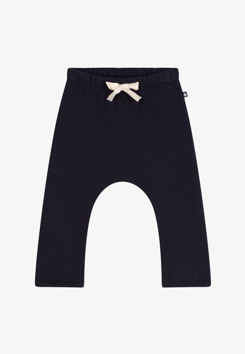 Marineblaue Baumwoll-Jogginghosen mit einer lockeren Passform, ausgestattet mit einem elastischen Bund und einem cremefarbenen Zugband. Flache Nähte am Saum.