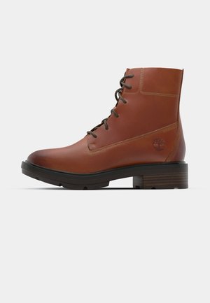 Brown leather ankle boot with round toe, lace-up design, contrasting stitching, and a block heel. Features a tree logo on the side.