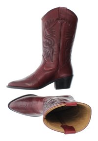 Burgundy leather cowboy boots with embroidered eagle design, pointed toe, and stacked heel. Smooth texture with contrasting tan interior.