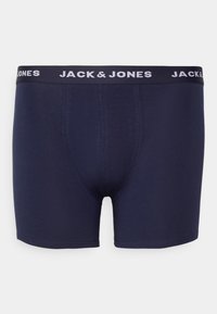Marineblaue Boxershorts mit enger Passform, aus weichem Stoff, mit einem weißen elastischen Bund, der mit dem Logo „JACK & JONES“ versehen ist.