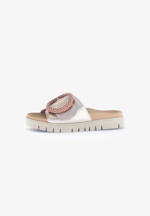 Slide sandal in metallic pink and nude tones, featuring a round beaded accent. Textured rubber sole with a thick, ridged design.