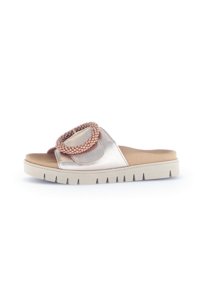 Slide sandal in metallic pink and nude tones, featuring a round beaded accent. Textured rubber sole with a thick, ridged design.