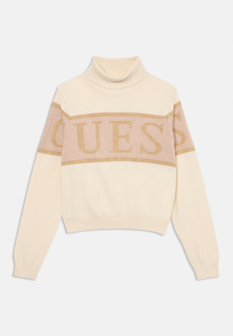 Maglione a collo alto crema con un design corto, caratterizzato da un logo "GUESS" in glitter dorato orizzontale sullo petto e polsini a coste.