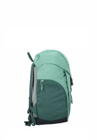 Green backpack with a rounded top, textured fabric, side mesh pocket, adjustable straps, and a dark base section. Zipper closure visible.
