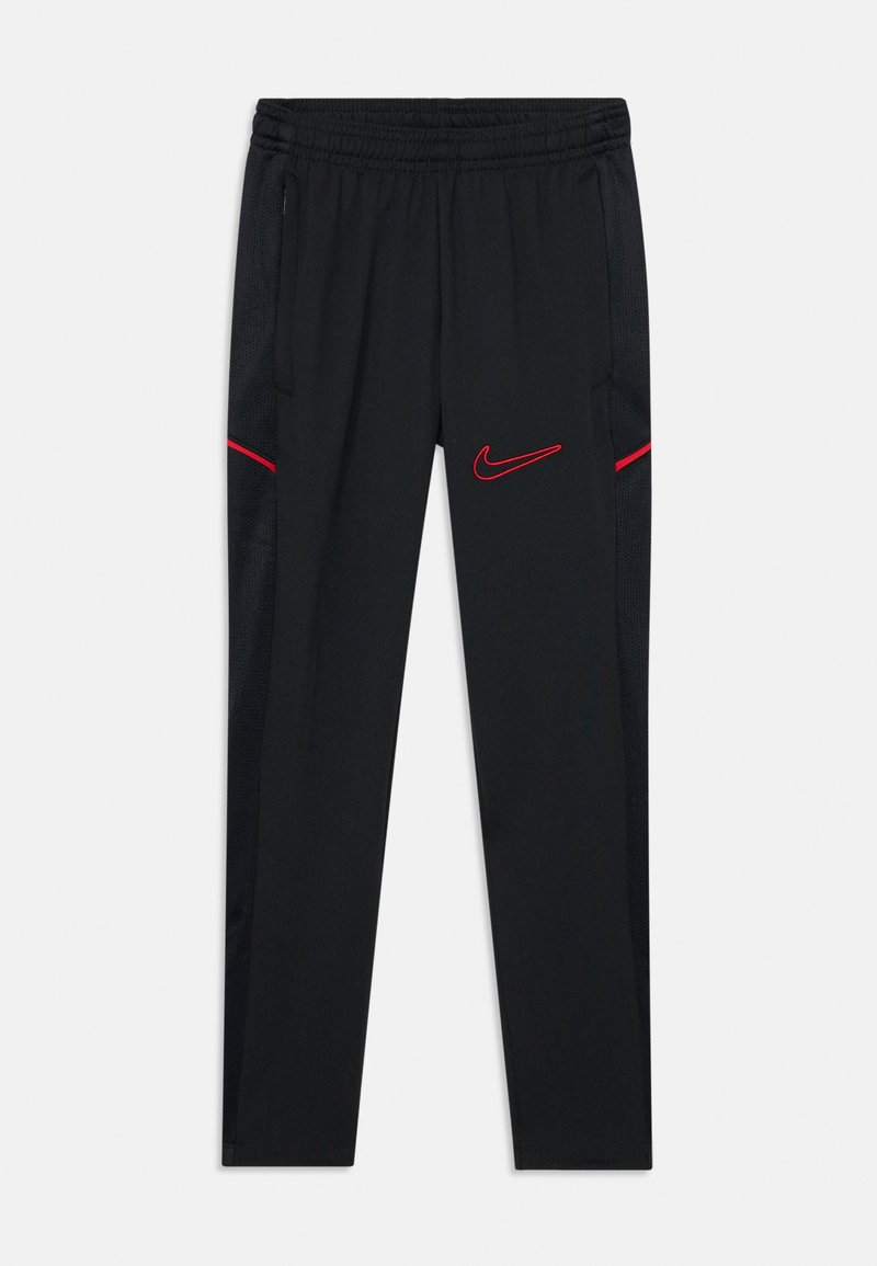 Svart Nike-byxor med elastisk midja, med röda accenttrådar och sidofickor, samt texturerade meshpaneler på sidorna.