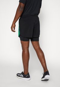 adidas Performance BRLN 2IN1 OUTDOOR - Pantalones montañeros cortos - black/vivid green