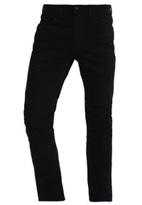 Jeans de mezclilla negra con un diseño ajustado, estilo de cinco bolsillos y una textura suave. Presenta un cierre de botón y cremallera.