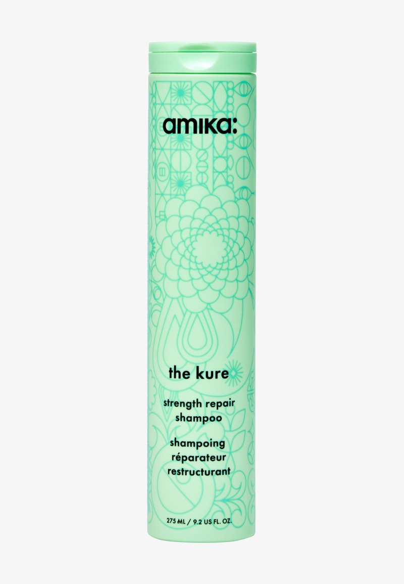 Mintgroene cilindervormige shampoo fles met bloemrijke lijntekening, voorzien van zwarte tekst voor productnaam en details, dop aan de bovenkant. 275 mL.