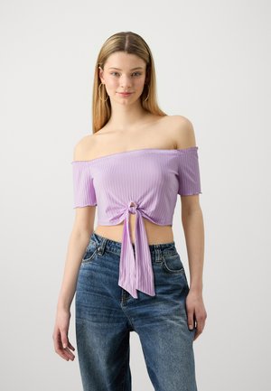 Light purple, ribbed off-the-shoulder crop top with short sleeves, featuring a front knot detail and flowing tie at the waist.