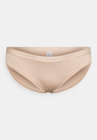 Boxer bege sem costura com uma textura suave e lisa. Apresenta um logótipo da Calvin Klein na cintura. Projetado para conforto e mínima visibilidade.