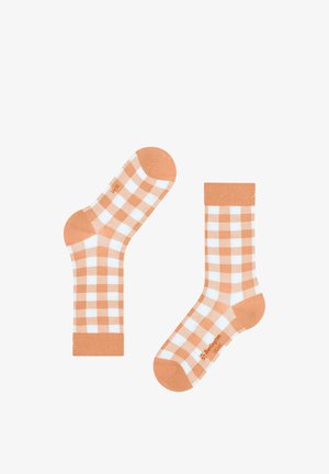 Chaussettes mi-mollet avec un motif vichy orange et blanc, bouts, talons et bords unis orange, posées à plat sur un fond blanc.