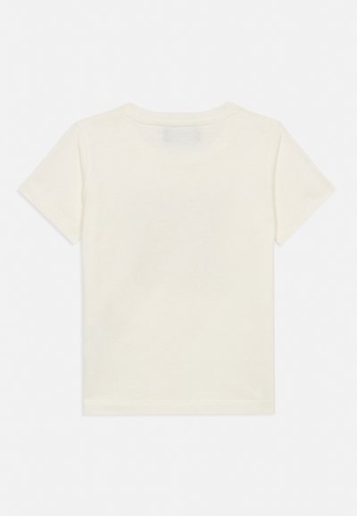 Preprosta kremna kratka majica z ravnim razporeditvijo, prikazana od zadaj z okroglim izrezom in brez vidnega vzorca ali besedila.
