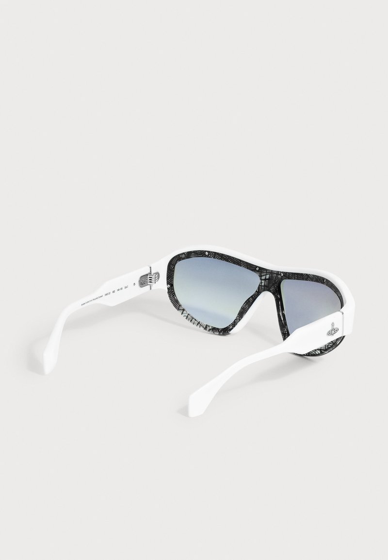 White frame sunglasses with black patterned rims and blue-tinted mirrored lenses resting on a plain light surface.