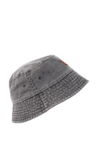 Gray bucket hat made of textured fabric. Features a round crown, a wide brim, and a leather patch on the side.