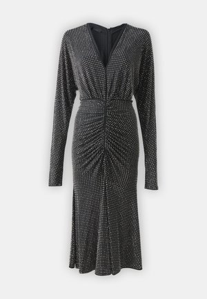 Black long-sleeve dress with silver dot pattern, V-neckline, ruched detailing at waist, and a fitted skirt. Soft fabric with a smooth texture.