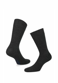 Skarpetki w kolorze węgorzowym wykonane z miękkiego, teksturowanego materiału. Posiadają ściągacz oraz subtelny niebieski detal z logo po boku.