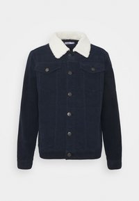 Giacca in corduroy blu scuro con colletto in sherpa bianco, chiusura frontale con bottoni e due tasche sul petto con pattina e bottoni.