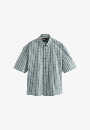 Rövid ujjú gombos ing zöld és kék kockás mintával, hegyes gallérral és egyetlen mellzsebével. Könnyű anyag.