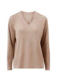 Camisa de manga larga color beige claro con cuello en V, hecha de una tela suave y de textura lisa. Dobladillo recto y sin patrones o acentos visibles.