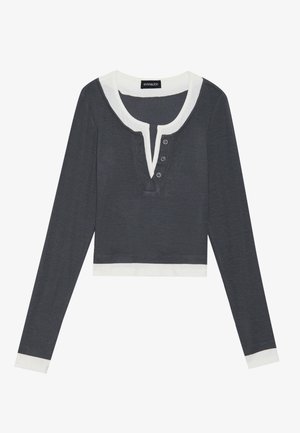 Dark gray long-sleeve top with white collar and cuffs, featuring a deep V-neck and four button placket. Soft, lightweight fabric.